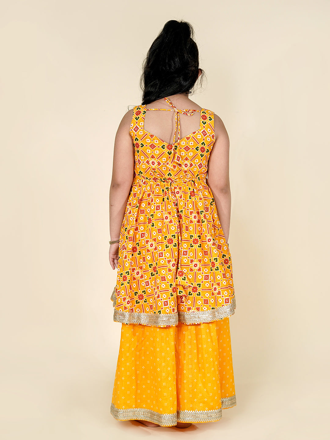 Girls Patola Print Yellow Peplum Kurti With Flared Palazzo 