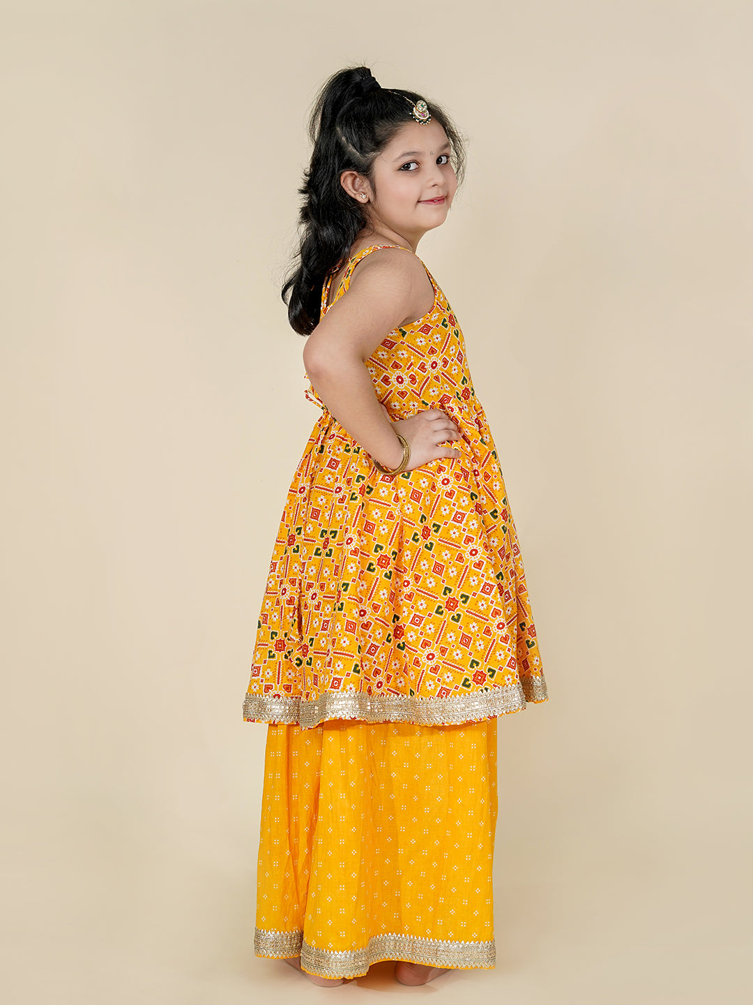 Girls Patola Print Yellow Peplum Kurti With Flared Palazzo 